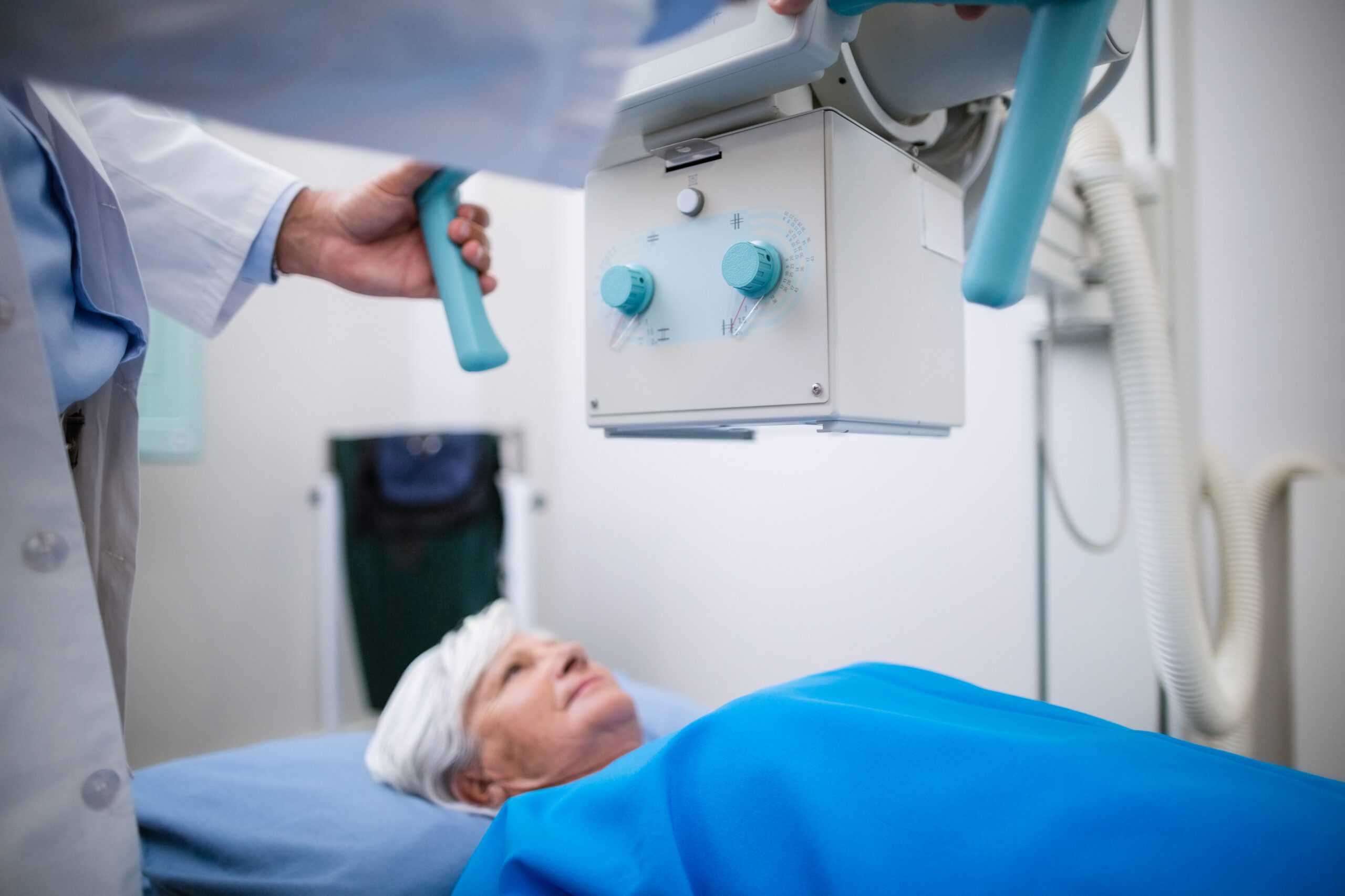 senior woman undergoing x ray test scaled