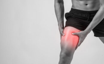 young sport man with strong athletic legs holding knee with his hands pain after suffering ligament injury isolated white 1024x683